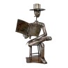 Metal statue representing a storyteller inviting meditation